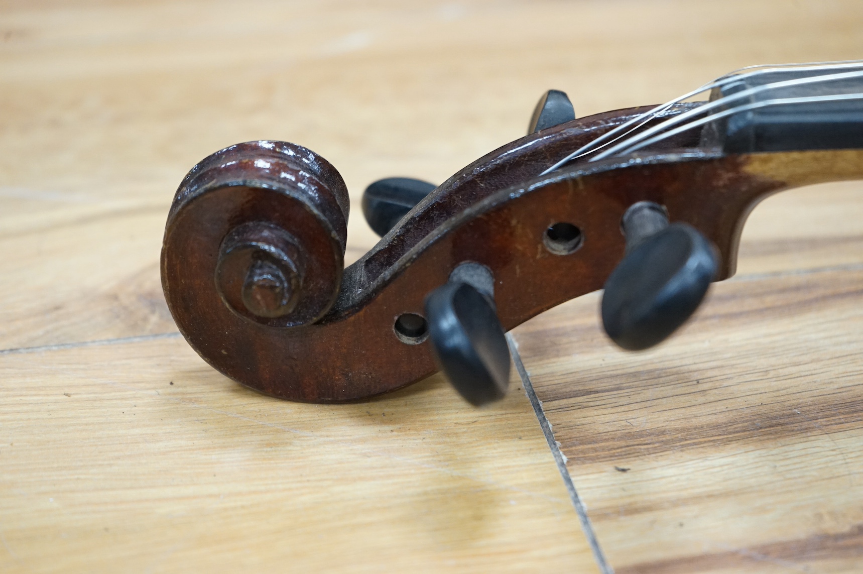 A cased violin, label to interior reads ‘Dulcis et Fortis’, back 36cm. Condition - scratches